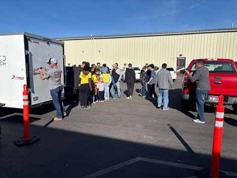 A group of volunteers standing outside the Kuna Food Bank waiting for the food drive to begin