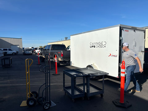 Utility trailer loaded with food bank supplies